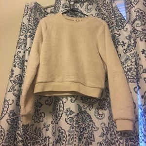 Size medium cream Tillys sweater new without tags.